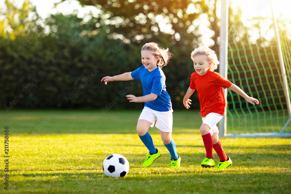 An image of children playing soccer. 